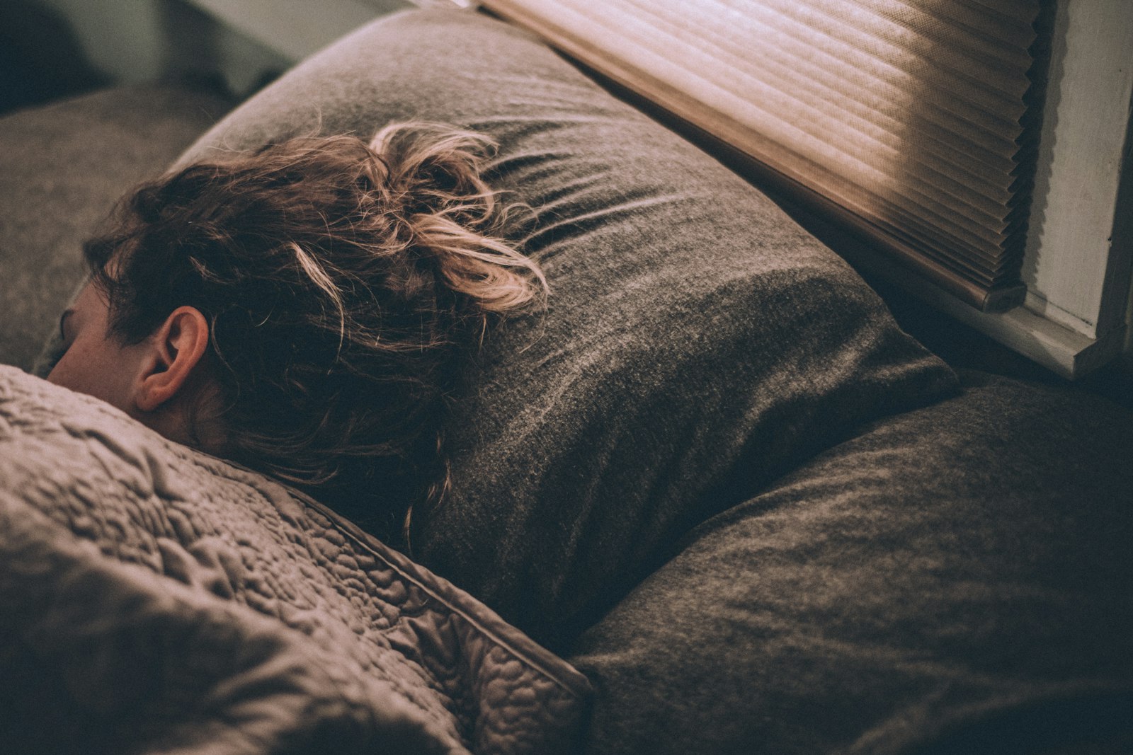 Person sleeping comfortably with proper pillow and neck support